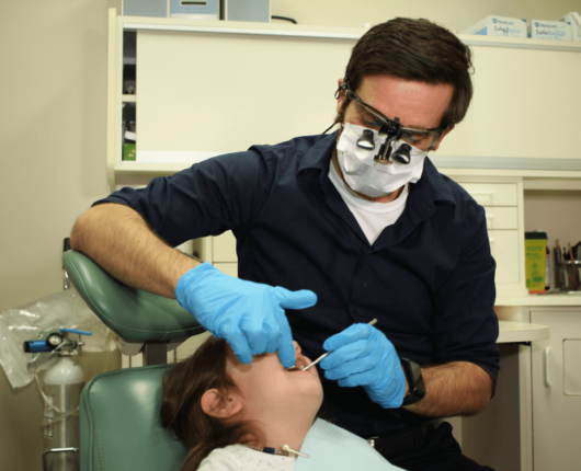 Patient treatment at Girardi Dental