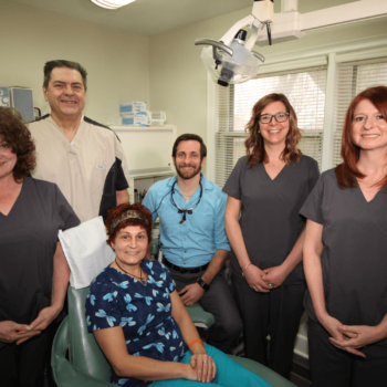 Patient with dental staff at Girardi Dental